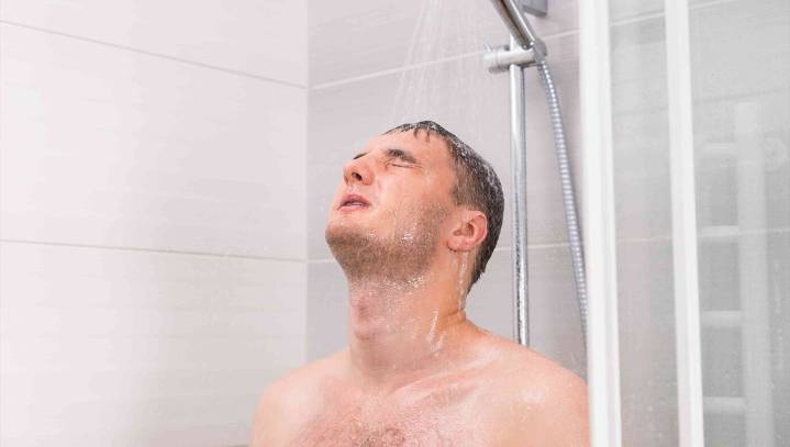Man Scientists Confirm Washing Your Hair and Just Kinda Letting Shampoo Run Down Rest Of You 'Good Enough'