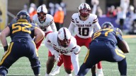 Morton throws for 3 TDs, LB Rodriguez scores on offense again and Texas Tech whips WVU 49
