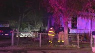 Firefighters say candle to blame of fire that destroyed trailer home, motor home