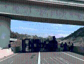 Box truck overturns, blocks traffic lanes on I