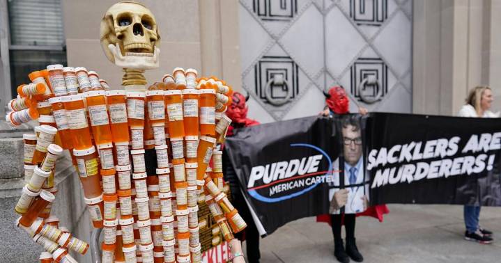 Judge approves opioid settlement for Purdue Pharma and Sackler family members who own the company