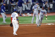 Miguel Rojas cements place in Dodgers' history: 'Biggest hit he's ever had in his life'
