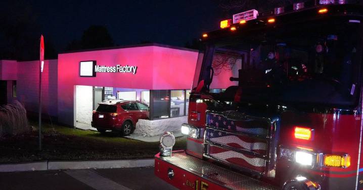 Employee at Denver metro area business narrowly avoids injury when vehicle crashes through wall