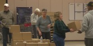 Line for food begins 6 hours before for emergency distribution began in Quad Cities