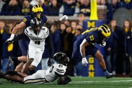 Jordan Marshall runs for 185 yards and 3 TDs to help No. 21 Michigan hold off Purdue for 21
