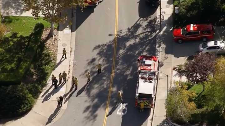 Fire crews working to rescue a dog stuck in a sewer in Santa Clarita