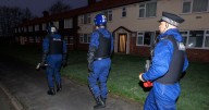 Cops swarm Greater Manchester suburb and raid homes as 15 arrests made