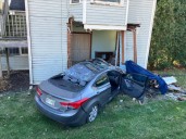 Car carrying 3 people crashes into house in Washington County