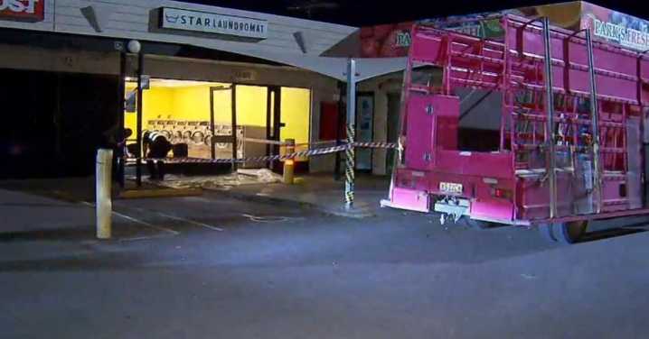 Child, cleaner narrowly escape as car ploughs into laundromat