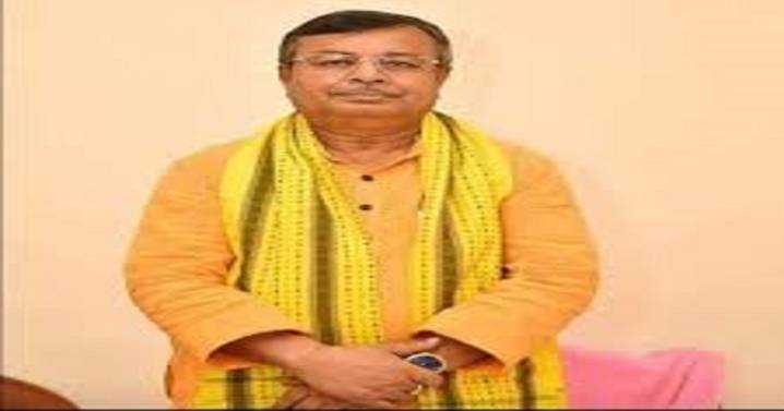 Ratan Lal Nath takes to paddy field to cut rice plants for encouraging farmers