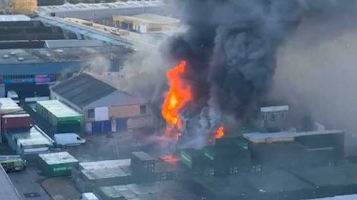 Major fire and explosions hit warehouse in west London