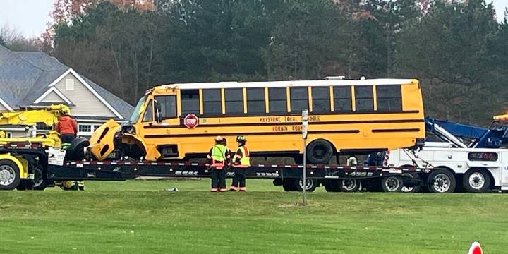 Keystone school bus overturns after getting hit by car