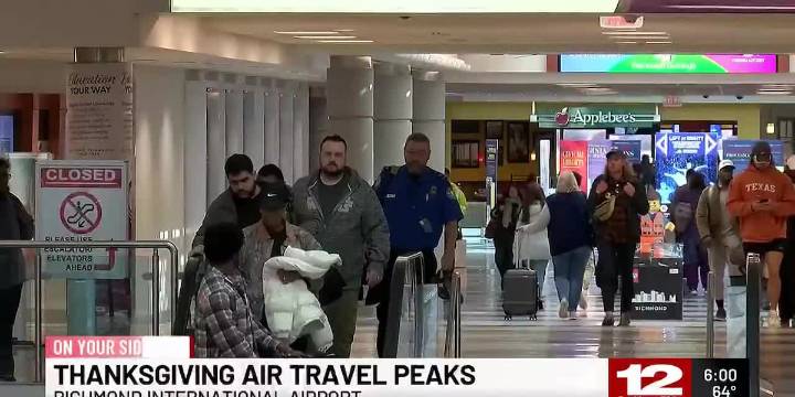 Travelers navigate busy airports on peak Thanksgiving travel day