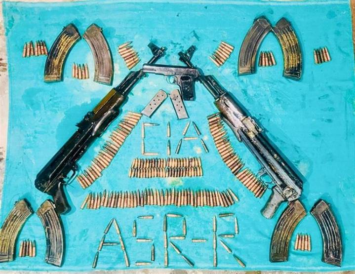 Two AK series assault rifles, One sophisticated pistol recovered from near Indo