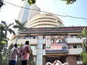Sensex, Nifty open flat; experts say volatility to continue as markets inching towards all time high