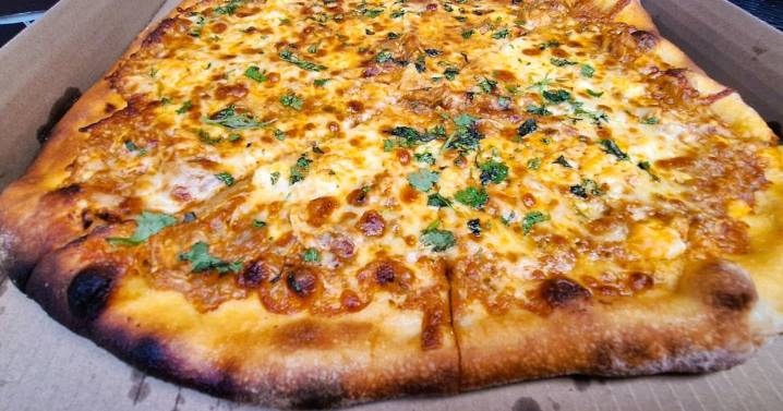 The fire is barely tamed. The pizzas are wild.