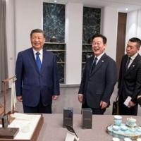 Xi jokes about spying with Chinese phone gift for South Korea's Lee