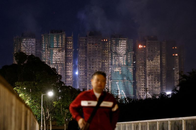 Toll in Hong Kong fire rises to 65, police cite 'grossly negligent' firm