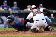 Twins trade for catcher, agree to terms for Justin Topa