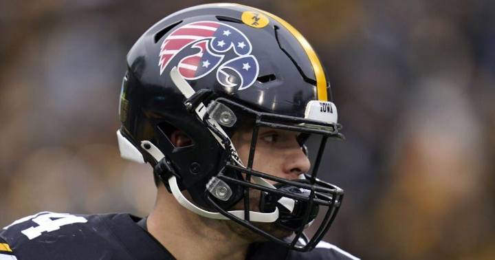 The story behind Iowa’s military appreciation helmet decals, a program staple since 2011