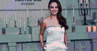 Mila Kunis Steals Spotlight in Elegant Ivory Gown