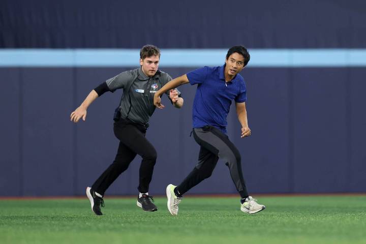 Spectator jumps on Rogers Centre field, disrupts play in Game 6 of World Series