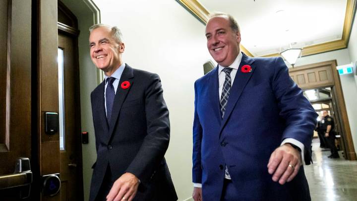 Carney walks former Conservative MP-turned-Liberal into first national caucus meeting