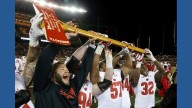 What do an axe, a bucket and a cannon have in common? Meet the rivalry trophies of college football