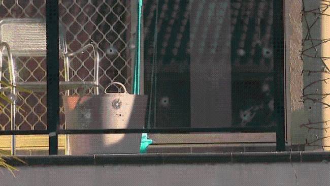 Manhunt underway after home peppered with bullets at Macquarie Fields in Sydney’s southwest