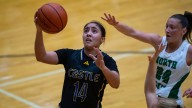 North Lady Huskies play the Castle Lady Knights in basketball action