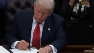 Trump signs bill to end historic government shutdown