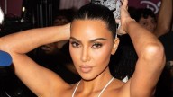 Kim Kardashian takes her bustier tulle dress for a swim