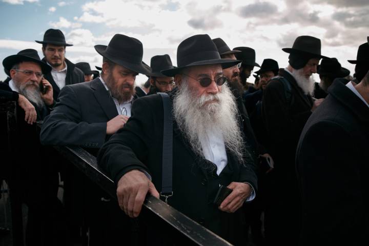 Photos of Hasidic Jewish rabbis praying at resting place of 'the Rebbe' in New York