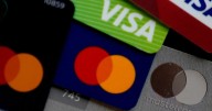 Credit cards: Visa, Mastercard reach fee settlement