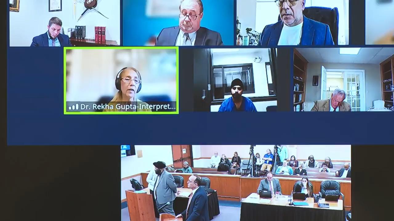 Trucker charged in Florida crash that killed 3 appears in court remotely