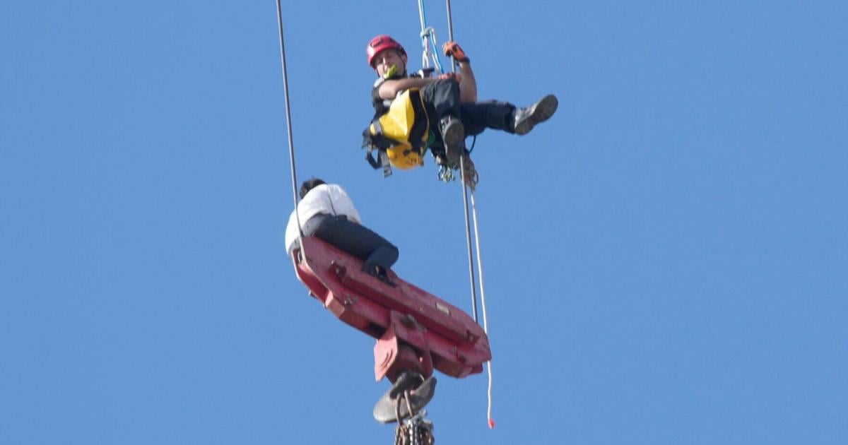Fire teams rescue 15-year-old stuck on crane over high