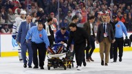 Maple Leafs' Chris Tanev stretchered off after collision