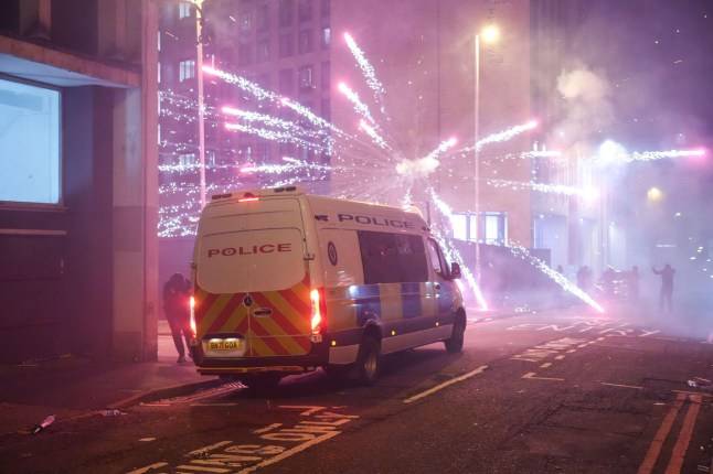 UK cities ‘under siege’ after masked youths blast fireworks at police