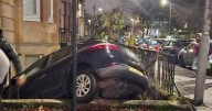 Car crashes into Glasgow tenement as police race to scene