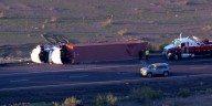 Driver hospitalized after semi-truck rollover on I