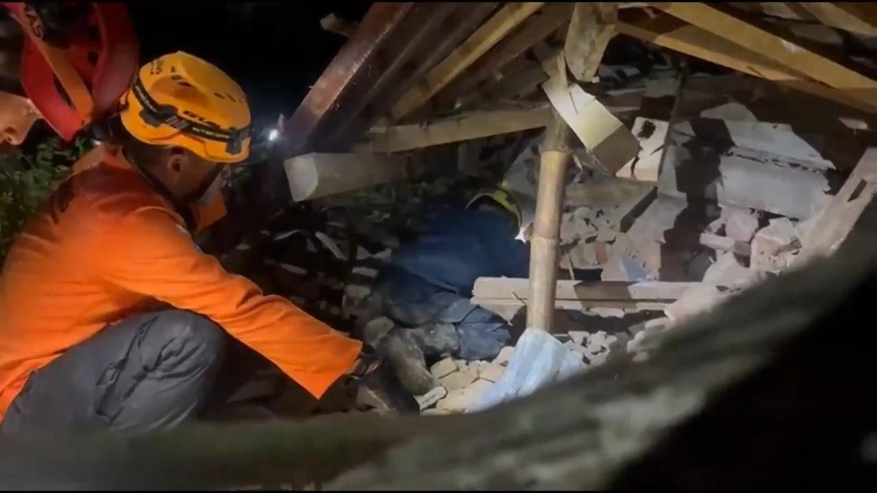 Fatalities in landslide on Indonesia's Java island as rescuers search for people still missing