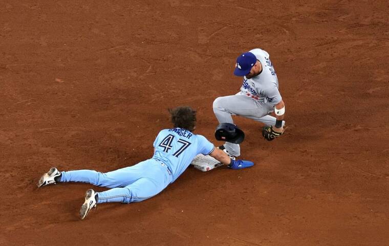 Dodgers escape late rally to force World Series Game 7