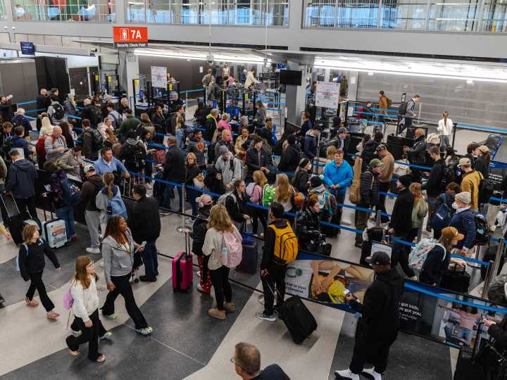 Hundreds of flights have been canceled after a snowstorm struck on one of the busiest travel weekends of the year