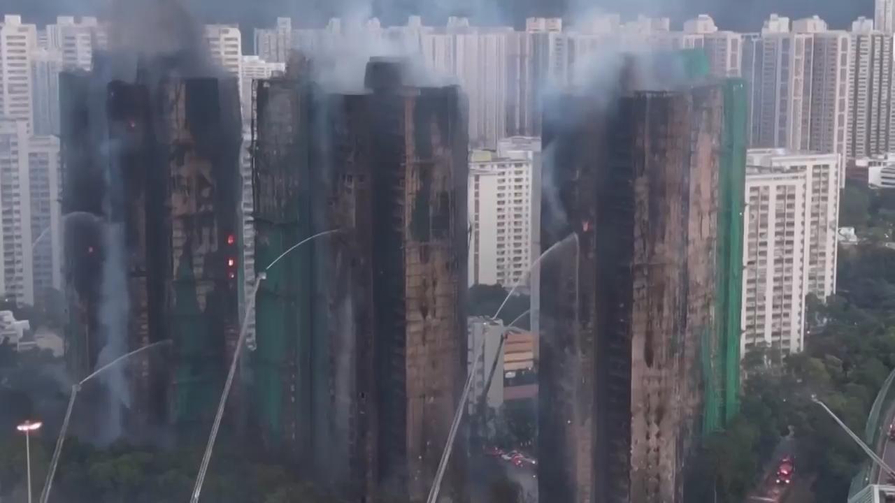 Residents evacuated from blazing Hong Kong building receive food, water and clothes at shelter