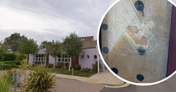 Masked hammer-wielding thug smashes hospice glass door in 'sickening' and 'malicious' act