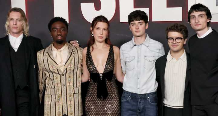 Millie Bobby Brown Wears Sequined Net Dress to ‘Stranger Things’ Fysee Event | Caleb McLaughlin, Finn Wolfhard, Gaten Matarazzo, Jamie Campbell Bower, Matt Duffer, Millie Bobby Brown, Noah Schnapp, Ro