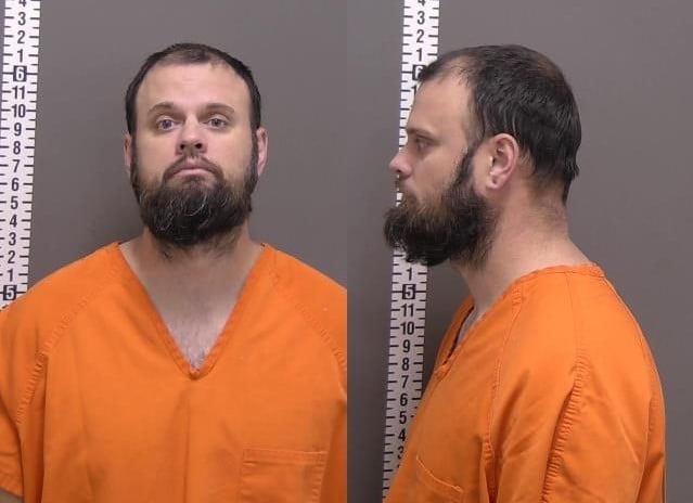 Naked man arrested after peeking through windows