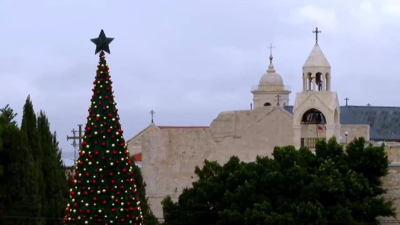 City workers prepare and decorate the Christmas tree in Manger Square in Bethlehem