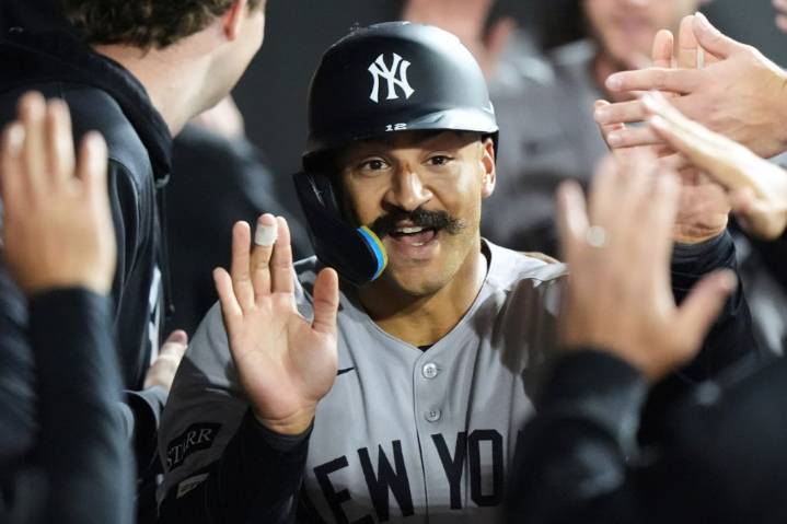 Grisham returning to Yankees after accepting qualifying offer