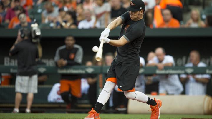 Brady Anderson is hired as the Angels' hitting coach, with John Mabry as his assistant